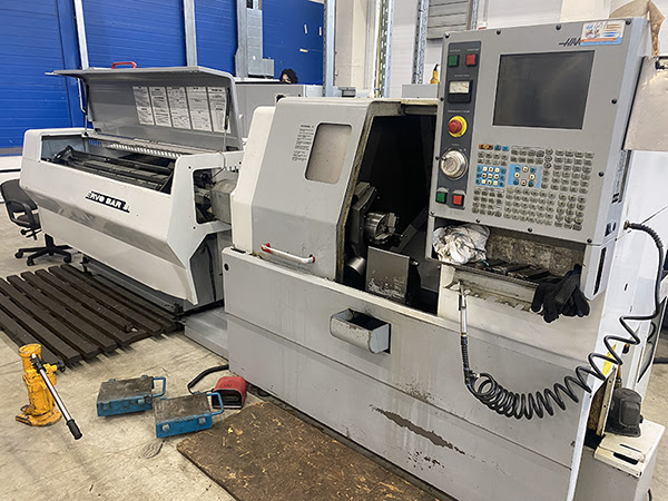 Haas SL-10HE (2003 | бу) с ЧПУ – токарный станок с прутковым податчиком