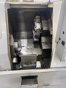 Haas SL-10HE (2003 | бу) с ЧПУ – токарный станок с прутковым податчиком